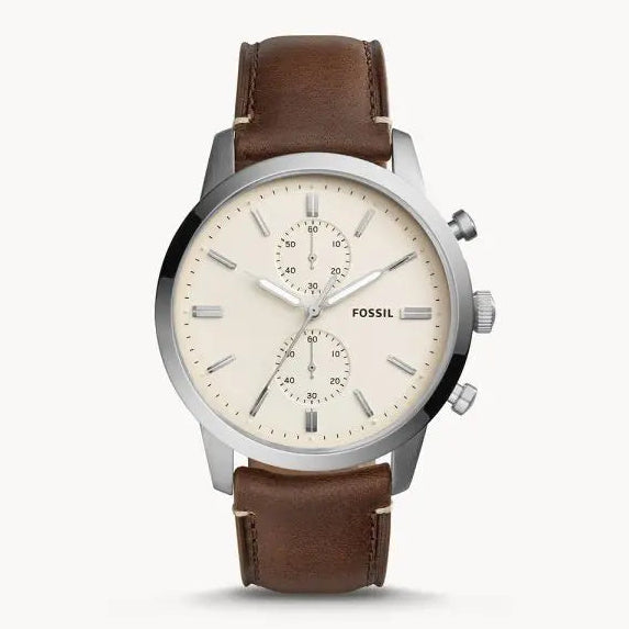Fossil watch with brown leather strap on a white background